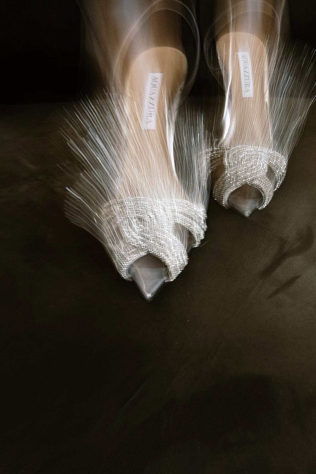 Dreamlike motion captures sparkling mesh heels, their beaded elegance hinting at a glamorous wedding night in Puglia, Italy.